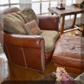 F14. Leather and fabric club chair and ottoman from Domain Furniture. 38&rdquo;w 